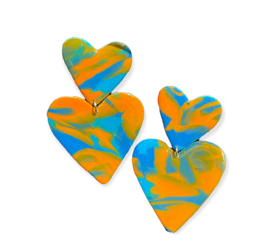 Complementary heart earrings