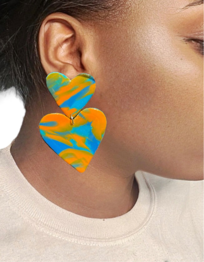 Complementary heart earrings