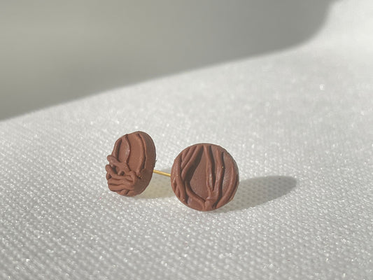 Loose end stud earrings